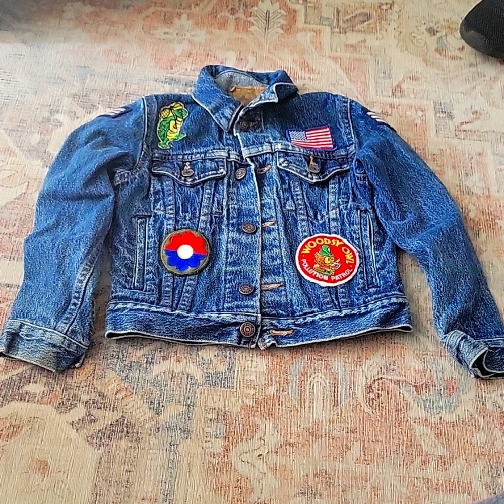 Blue jeans jacket with patches